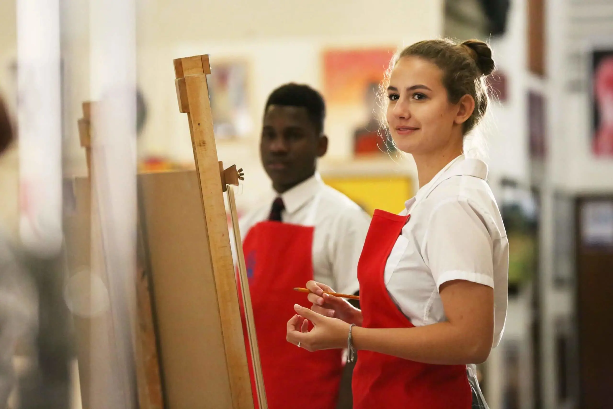 Seaford College pupils painting in an art lesson.